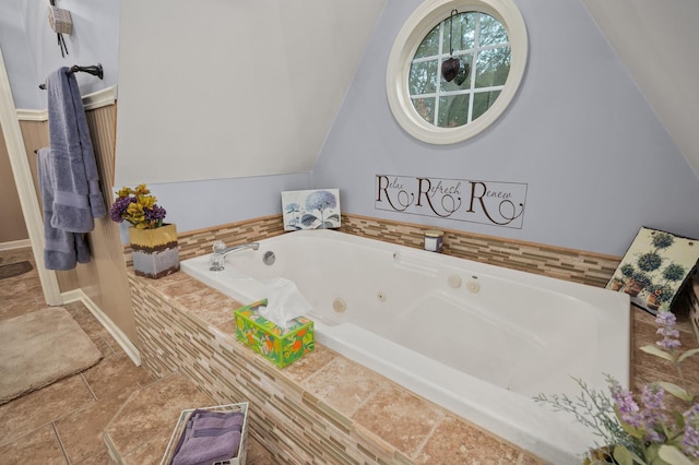 5995 W Clare Rd, Clare, IL 60111 - full bathroom with a jetted tub, lofted ceiling, and stone finish floors
