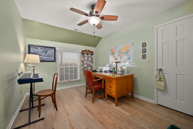 office area featuring light hardwood / wood-style floors, ceiling fan, and lofted ceiling