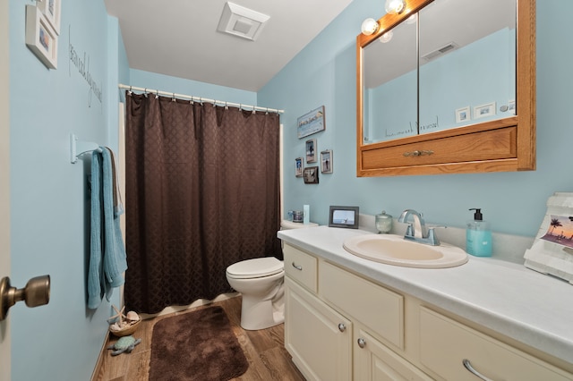 bathroom featuring toilet, a shower with curtain, vanity, and wood-type flooring