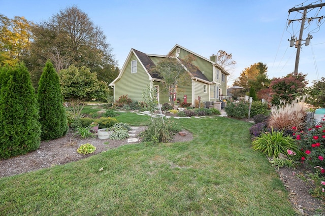 5995 W Clare Rd, Clare, IL 60111 - view of front of house with a front lawn and a chimney