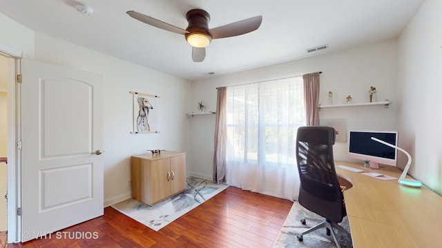 home office with ceiling fan and hardwood / wood-style floors