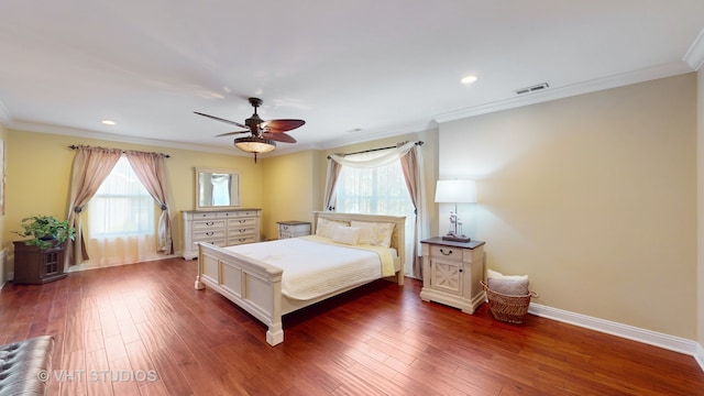 bedroom featuring dark wood-type flooring, crown molding, and ceiling fan