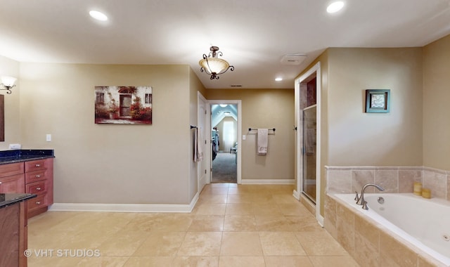 bathroom with vanity, tile patterned floors, and independent shower and bath