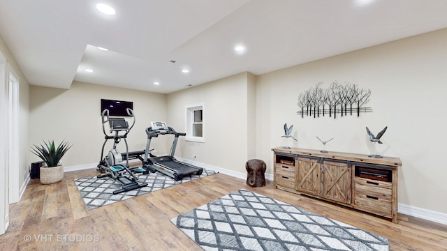 workout room with light wood-type flooring