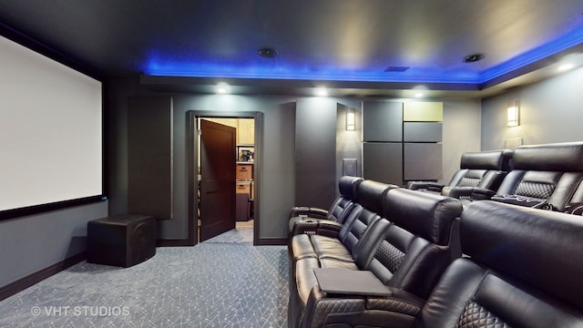 carpeted cinema room with ornamental molding