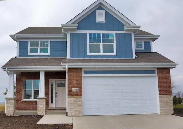 view of front facade featuring a porch and a garage