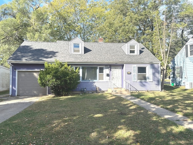 cape cod-style house featuring a front yard and a garage