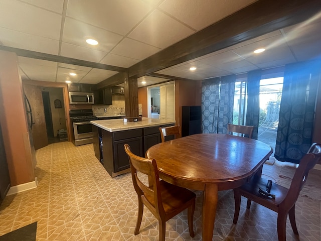 dining room featuring a paneled ceiling