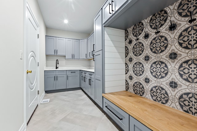 kitchen with gray cabinets and sink