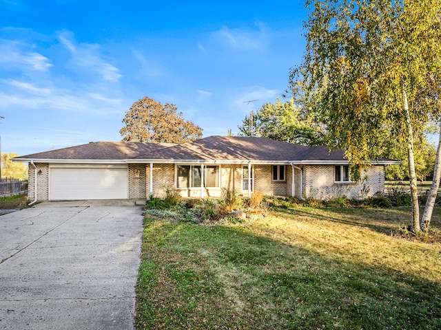 single story home with a front lawn and a garage