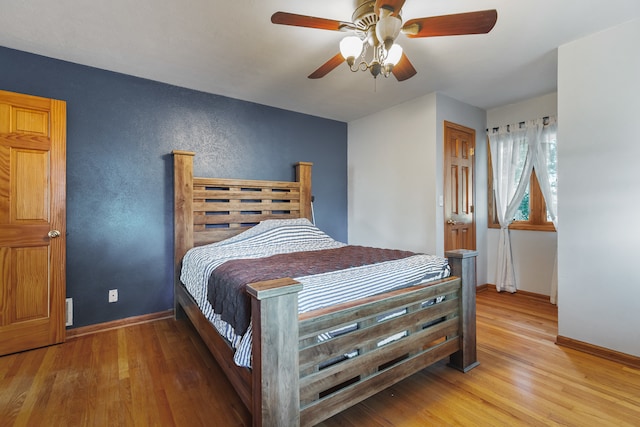 bedroom featuring ceiling fan and hardwood / wood-style flooring