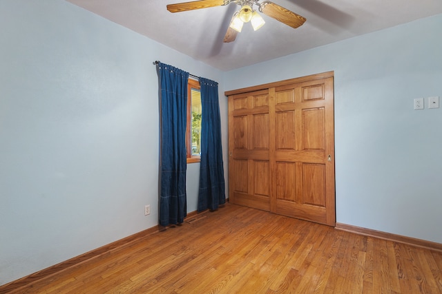 unfurnished bedroom with a closet, ceiling fan, and light hardwood / wood-style flooring