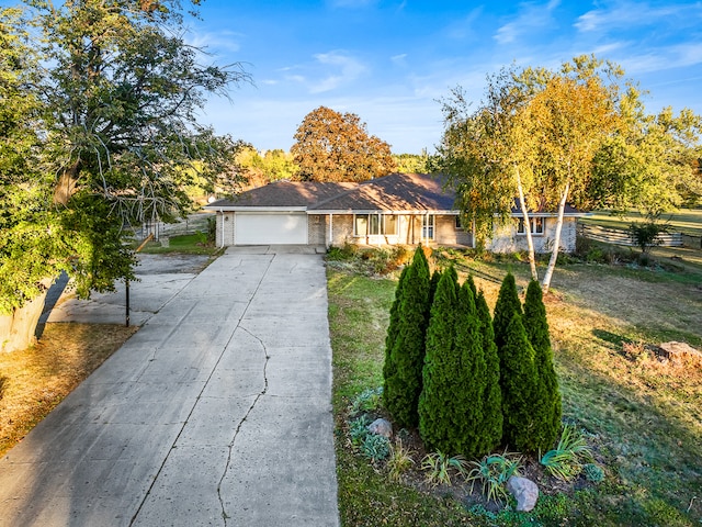 single story home with a front lawn and a garage