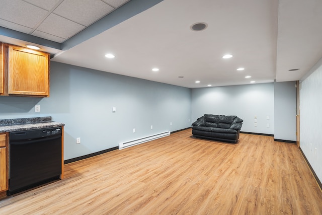 living area featuring light hardwood / wood-style floors, a baseboard heating unit, and a drop ceiling