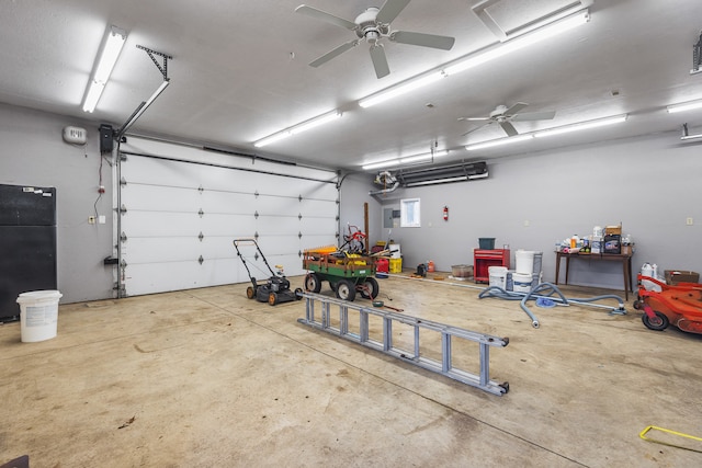 garage with ceiling fan and black refrigerator