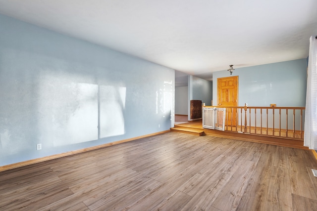 spare room featuring light hardwood / wood-style flooring