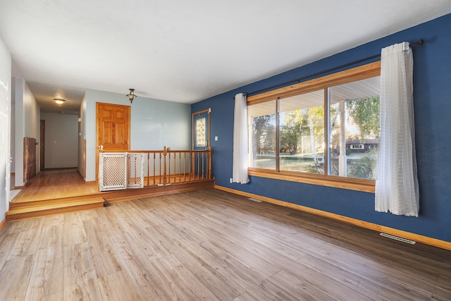 empty room featuring wood-type flooring