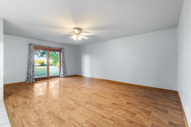 unfurnished room featuring light hardwood / wood-style floors and ceiling fan