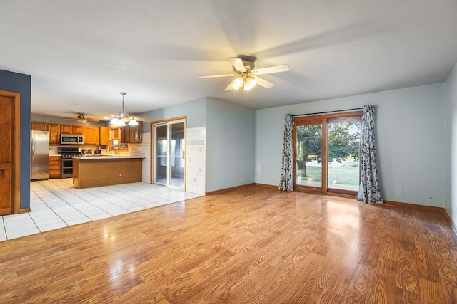 unfurnished living room featuring light wood-type flooring