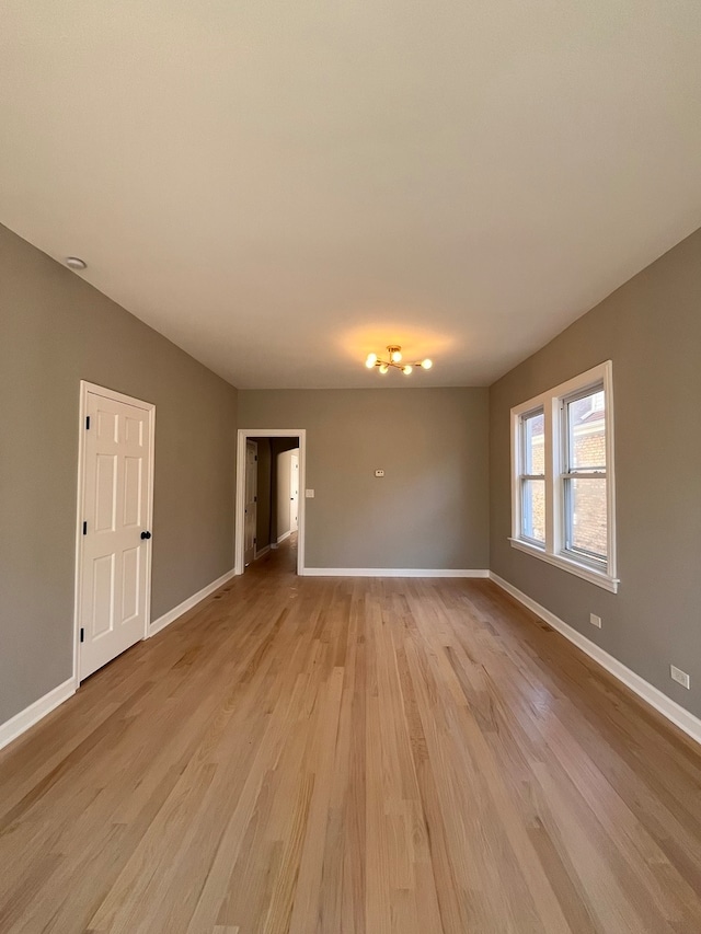 spare room with light wood-type flooring