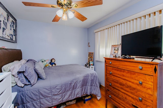 bedroom featuring wood-type flooring and ceiling fan