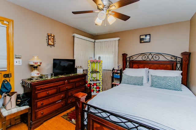 bedroom featuring ceiling fan and hardwood / wood-style flooring