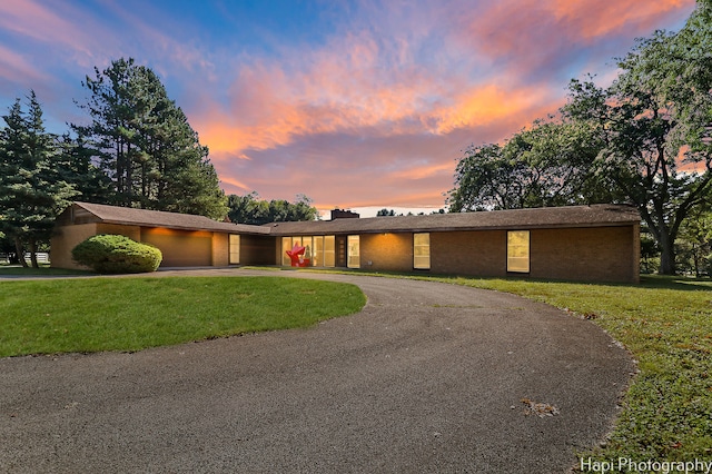 ranch-style house with a yard