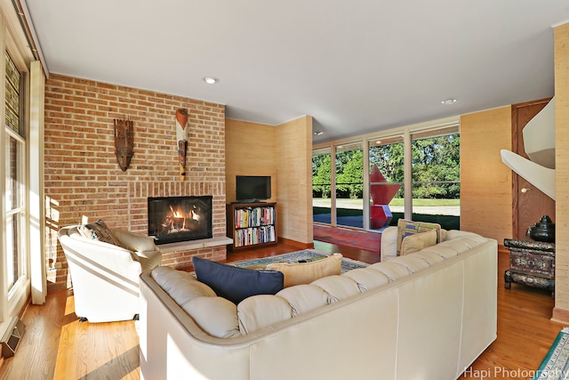 living room featuring light hardwood / wood-style floors and a fireplace