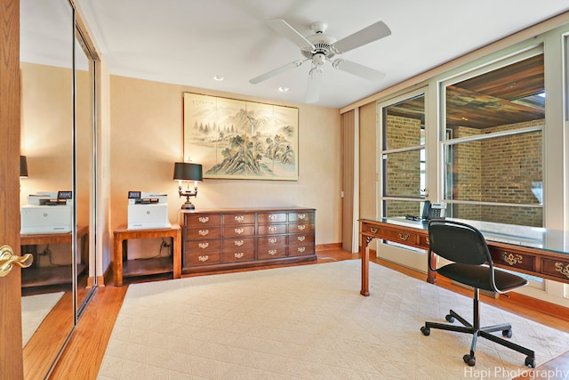 office area with ceiling fan and light wood-type flooring