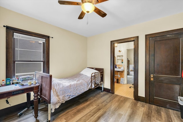 bedroom with ceiling fan and hardwood / wood-style flooring