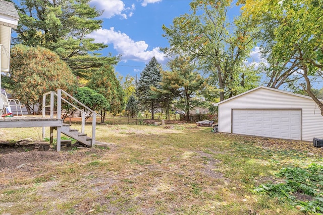 view of yard featuring an outbuilding and a garage