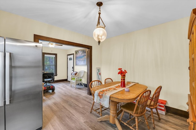 dining room featuring light wood-type flooring and ceiling fan