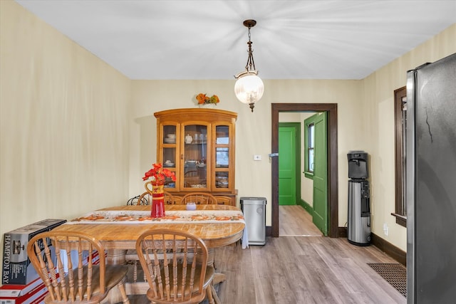 dining room with light wood-type flooring