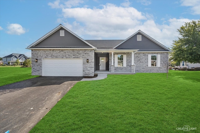 view of front of house featuring a front yard and a garage