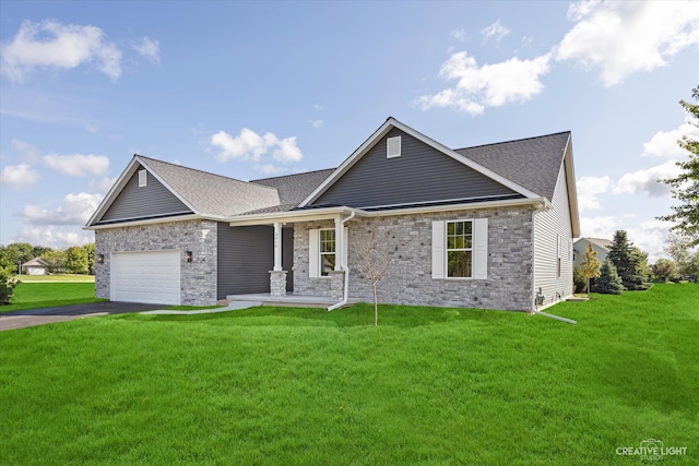 view of front of house featuring a front yard and a garage