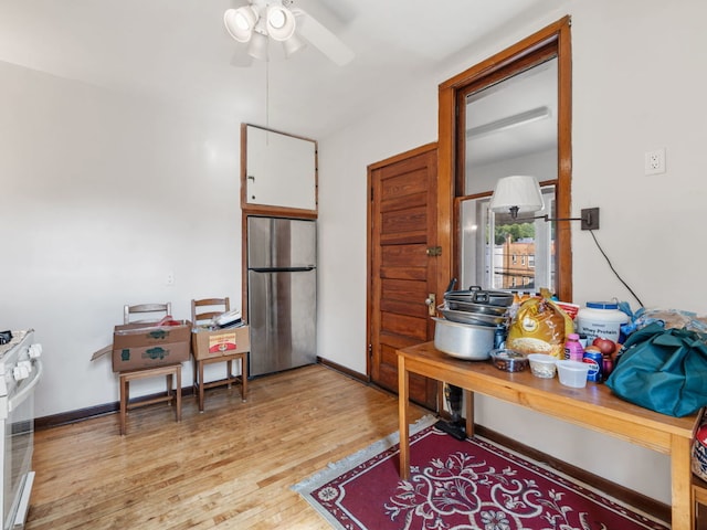 interior space featuring light wood-type flooring and ceiling fan