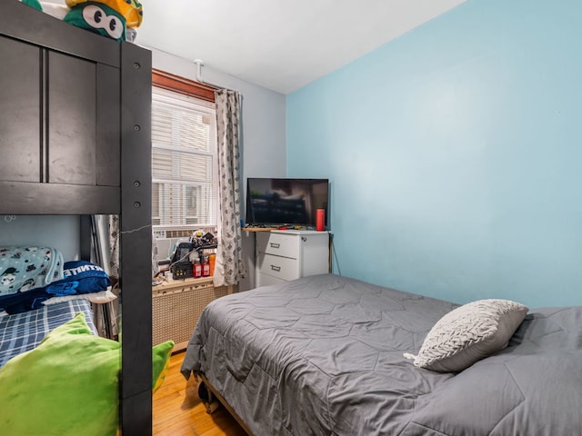 bedroom with light hardwood / wood-style floors