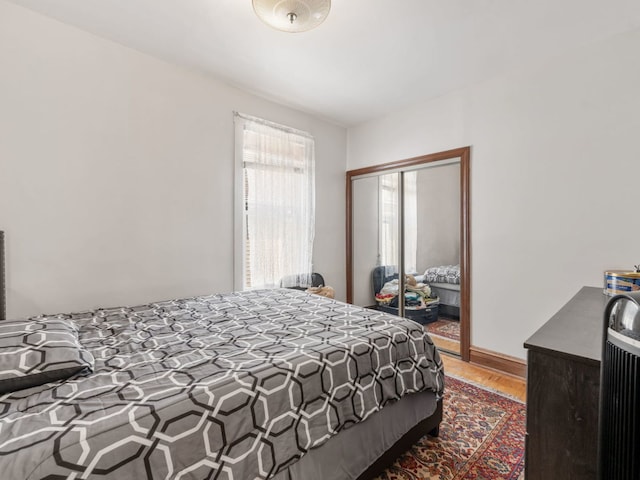 bedroom featuring a closet and hardwood / wood-style flooring