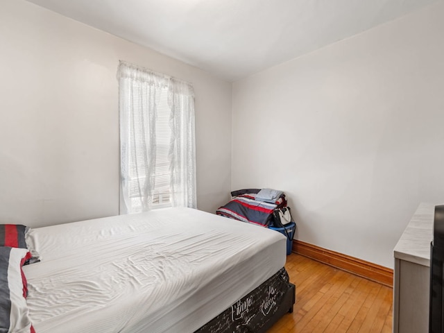 bedroom with light hardwood / wood-style flooring