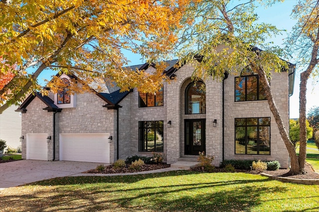 view of front facade featuring a front lawn and a garage