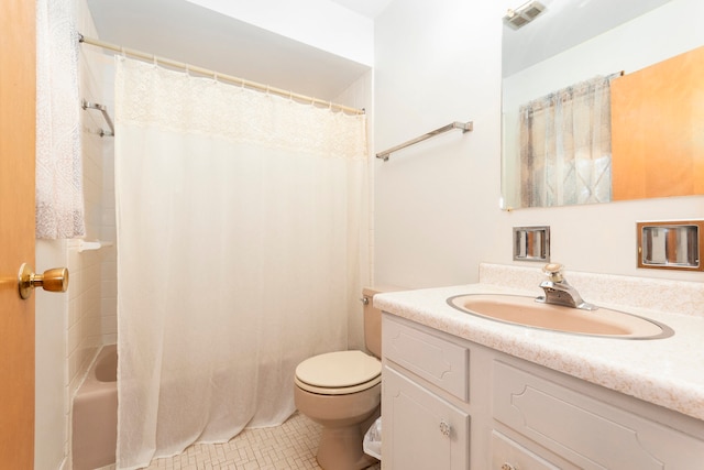 full bathroom featuring vanity, shower / bath combo with shower curtain, toilet, and tile patterned flooring