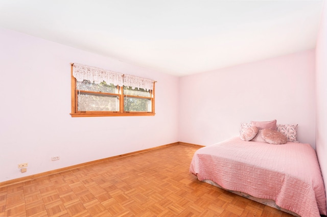 unfurnished bedroom featuring light parquet flooring