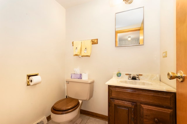 bathroom featuring vanity, toilet, and tile patterned flooring