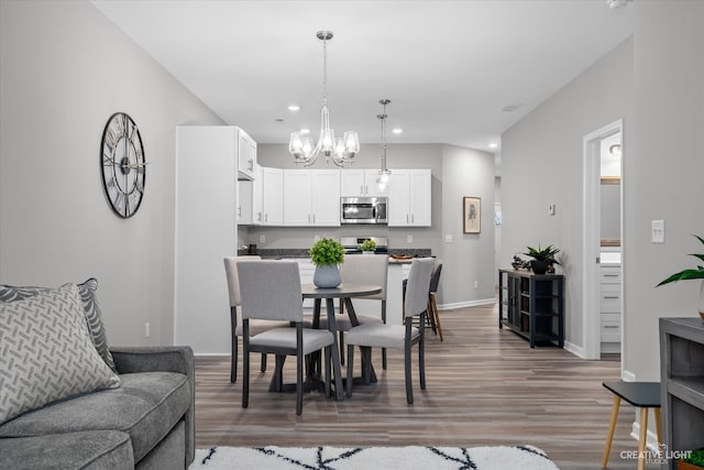 dining room featuring a chandelier and dark hardwood / wood-style flooring