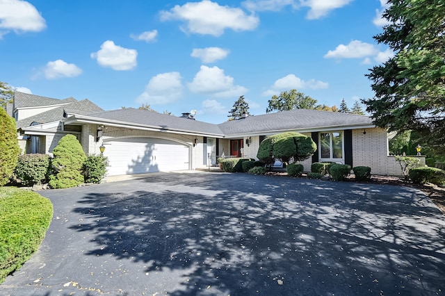 ranch-style house featuring a garage