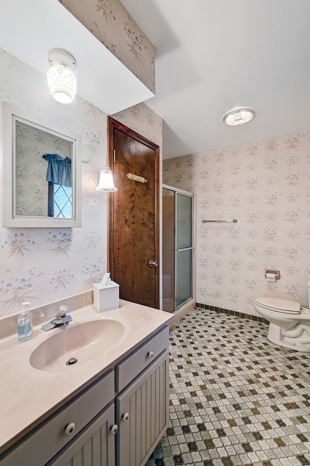 bathroom with vanity, walk in shower, and toilet