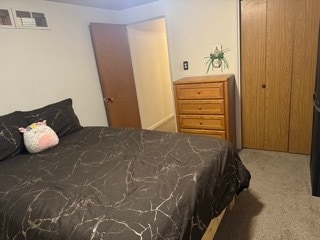 carpeted bedroom featuring a closet