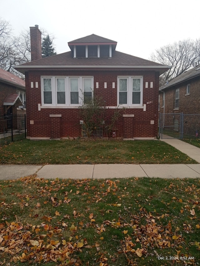 bungalow with a front lawn