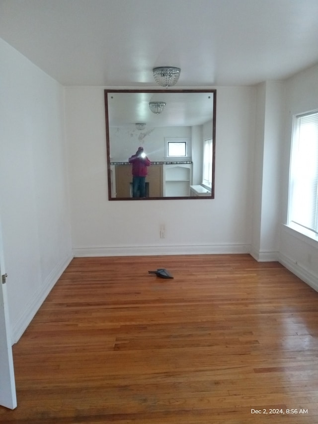 unfurnished room featuring hardwood / wood-style floors