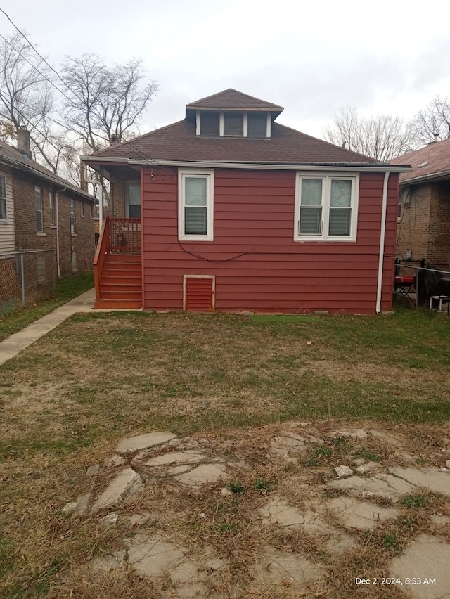 view of property exterior with a lawn